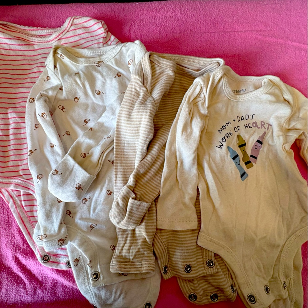 Four long sleeve carters onesie for newborn’s.